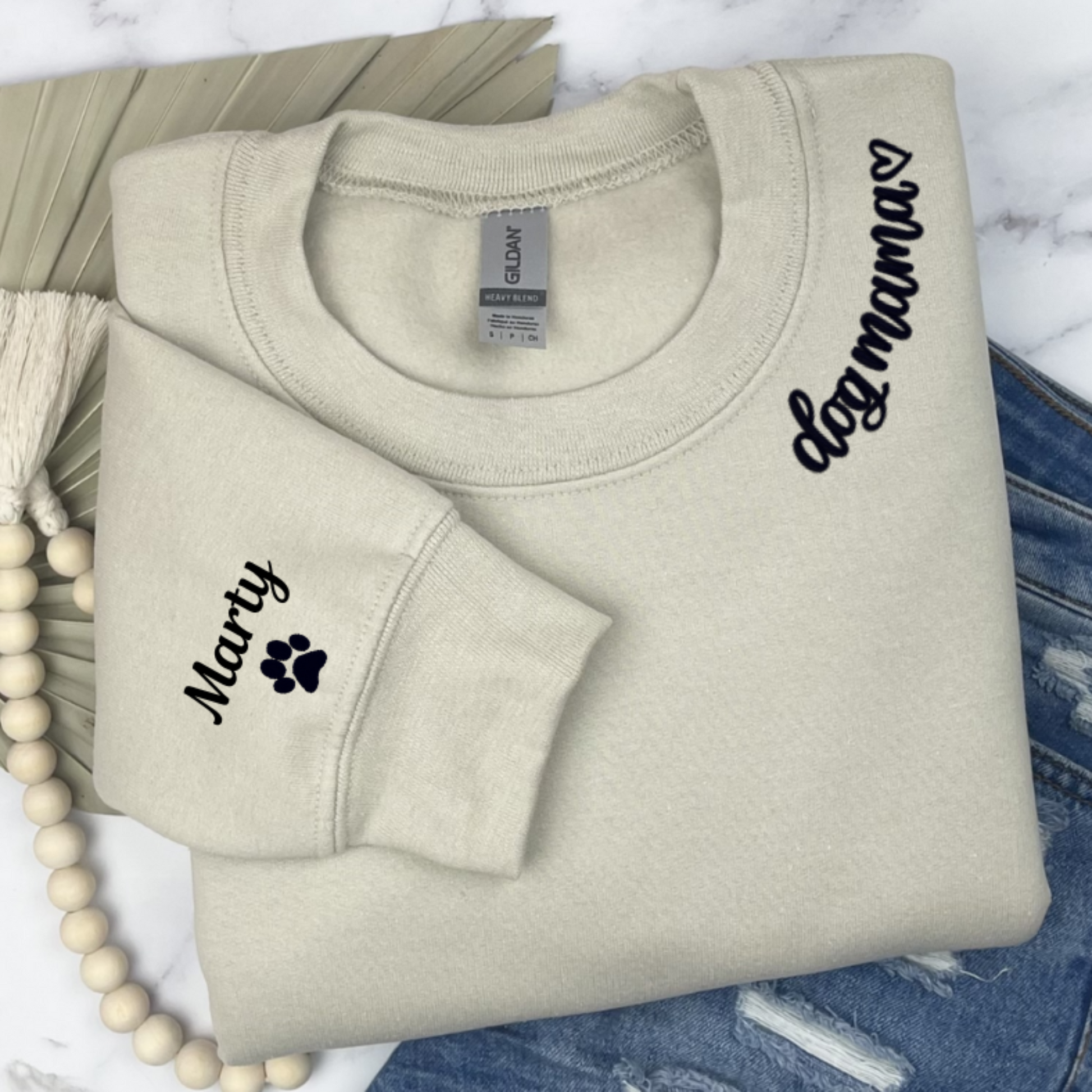 Sand sweatshirt with dog mama around collar and dog name on sleeve with a paw print