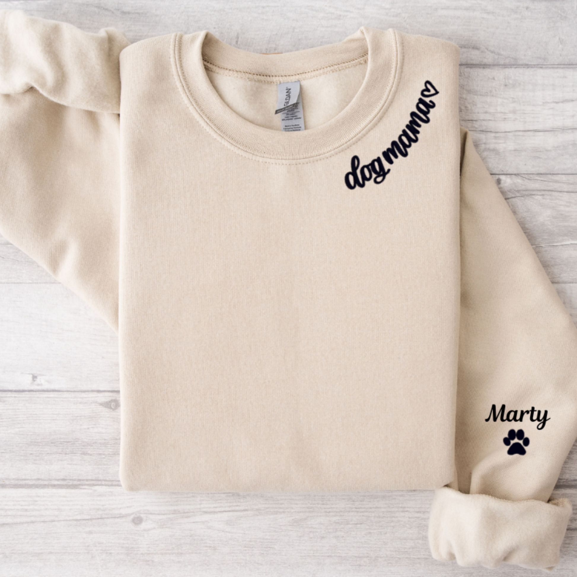 Sand sweatshirt with dog mama around collar and dog name on sleeve with a paw print