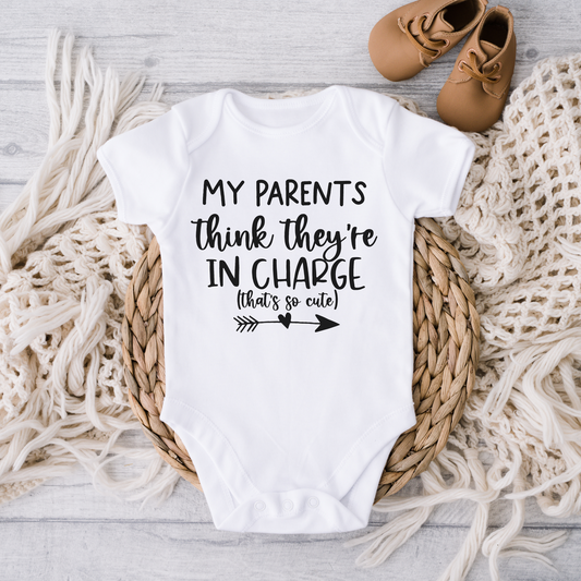Newborn White onesie with funny saying "My parents think they are in charge how cute"